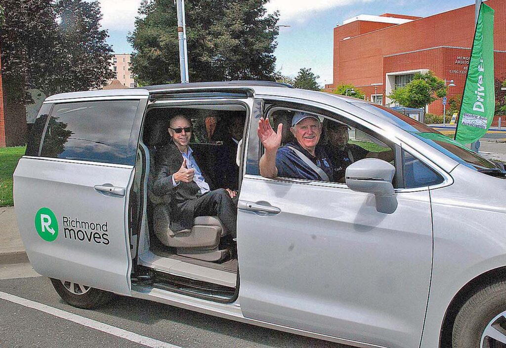Richmond Mayor Tom Butt rides in the new electric rideshare vehicle from Richmond Moves